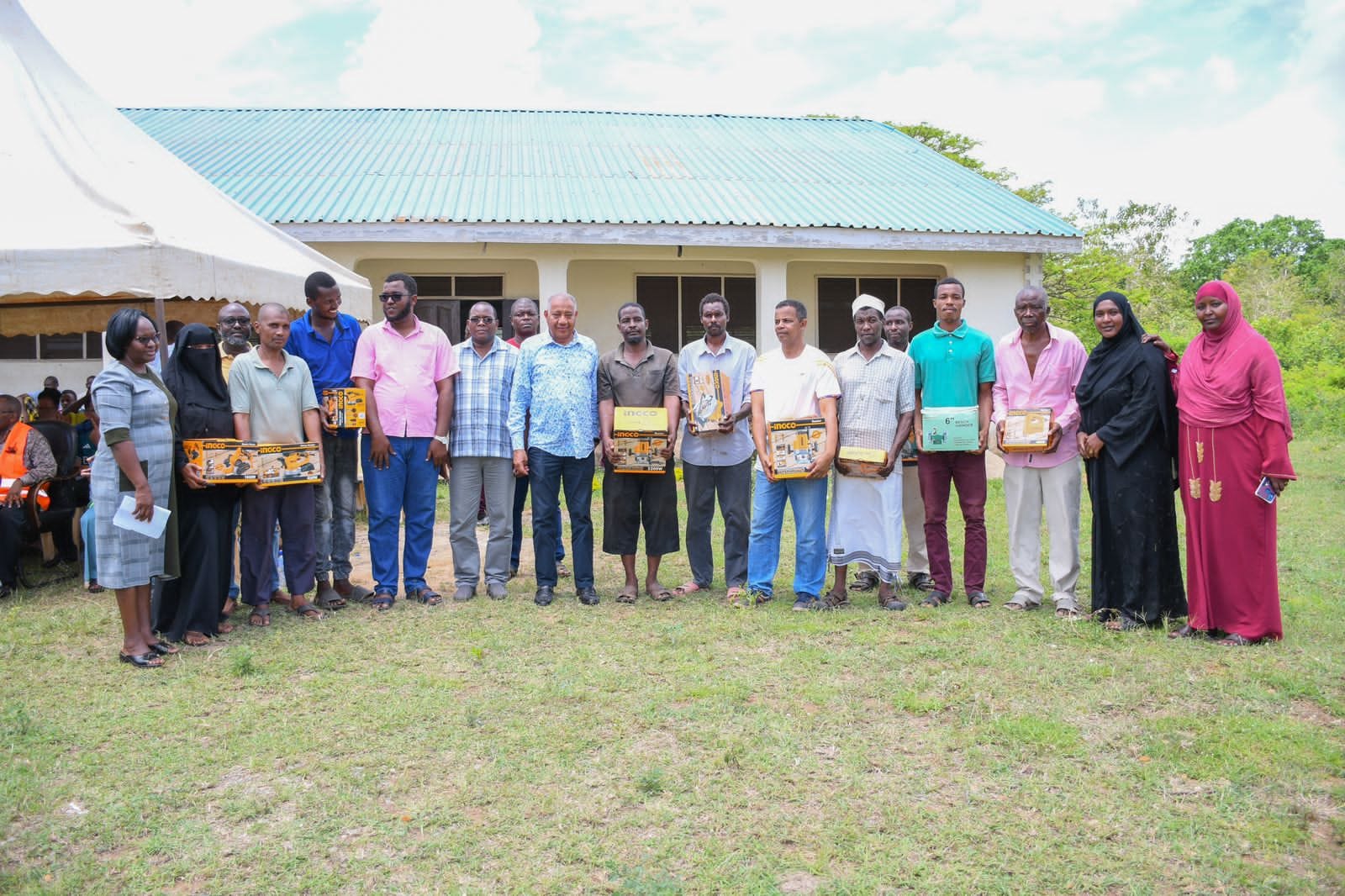 EMPOWERING THE YOUTH: Governor Timamy gives VTC graduates from Witu start-up kits to start their own businesses.